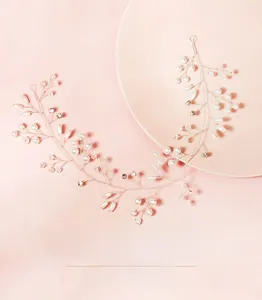 Detail of handmade bridal headband with white pearls and crystals on silver wire
