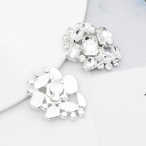 Detailed view of silver rhinestone shoe clips with polished alloy base and secure metal clasp