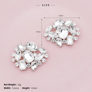 Detailed macro view of sparkling rhinestone shoe clips for bridal and party heels