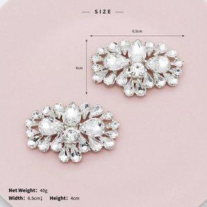 Detail showing removable rhinestone shoe clips with sparkling crystal clusters for wedding shoes