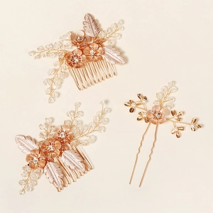Detailed view of handmade bridal hair comb set with champagne gold flowers and crystals