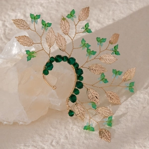 Handcrafted butterfly ear cuff with emerald crystals and gold leaves in forest style