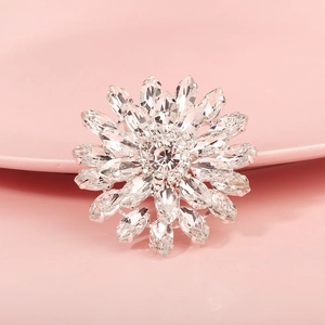 Close-up of sparkling floral shoe clip with radiant marquise rhinestones on silver base