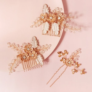 Detailed macro view of golden floral bridal hair comb with pearls and crystals
