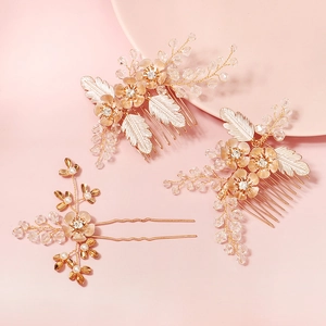 Detail of handmade bridal hair comb set with pink enamel flowers and pearls
