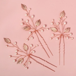 Three-piece handmade rose gold bridal hair pins with white beads and leaf ornaments