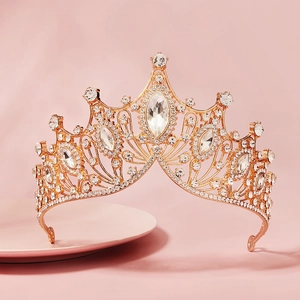 Detailed view of luxury baroque bridal crown with sparkling rhinestones and gold alloy base