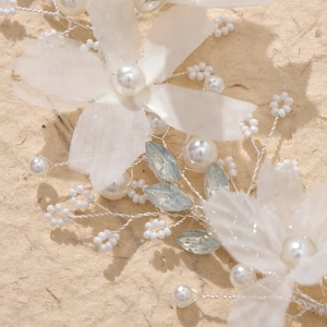 Handmade bridal hairband with white mesh flowers, pearls, and light blue crystals