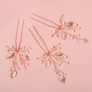 Handmade rose gold bridal hair pins with pearls and metal leaves for wedding hairstyles