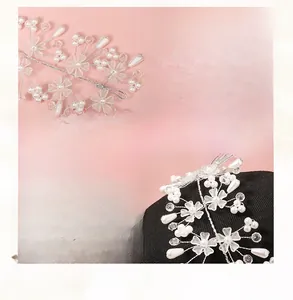 Close-up of handmade bridal headband featuring white acrylic pearls and frosted flowers