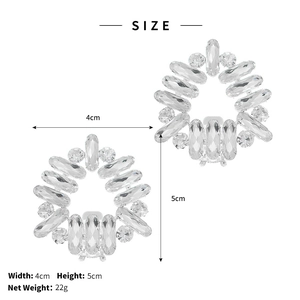 Macro detail of silver crystal rhinestone shoe clips with sparkling marquise gems