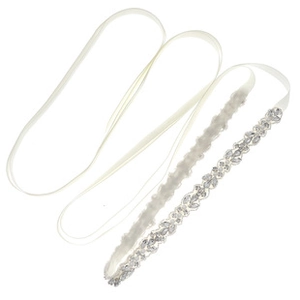 Detail of bridal sash with sparkling crystal rhinestones and elegant white satin ribbon