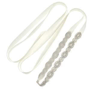 Detailed view of the white satin wedding sash with elegant sparkling rhinestone embellishments