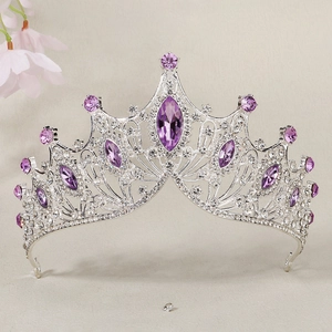Detailed macro view of luxury silver bridal crown with purple rhinestones and crystals