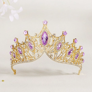 Detailed front view of luxury baroque bridal crown with purple rhinestones and gold alloy
