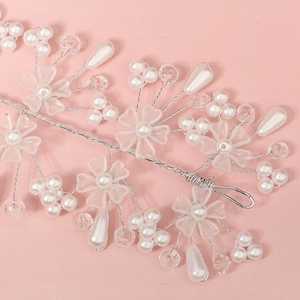Elegant bridal hairband with acrylic petals and pearls on silver wire for wedding dress