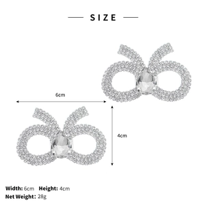 Macro view of crystal rhinestone shoe clips showing 6x4cm size and teardrop stone detail