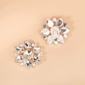 Detail view of sparkling silver rhinestone flower shoe clips with secure metal buckle back