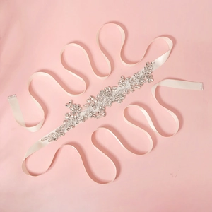 Elegant bridal belt with sparkling crystal rhinestones and white satin ribbon for wedding dresses