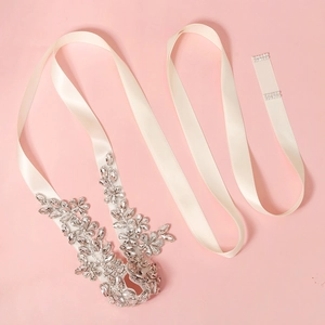 Elegant bridal sash with ivory satin ribbon and shimmering floral rhinestone crystals