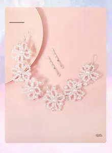 Detailed view of handmade flower bridal headband with crystal beads and white pearls