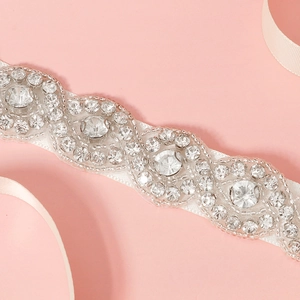 Elegant bridal sash with hand-sewn silver crystals and white satin ribbon for wedding dresses