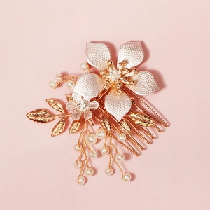 Elegant bridal hair comb with handmade pearls, white flower petals and golden metal leaves