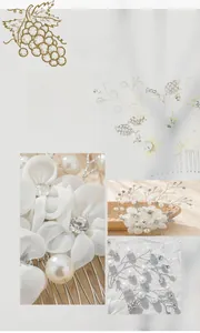 Detailed view of handmade bridal hair comb with fabric flowers, pearls, and rhinestones