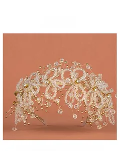 Detail of handcrafted gold wire bridal headband with clear crystal beads and ivory pearls