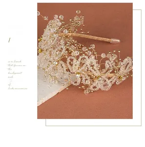 Macro shot of handcrafted bridal headband with crystal beads and gold wire detailing