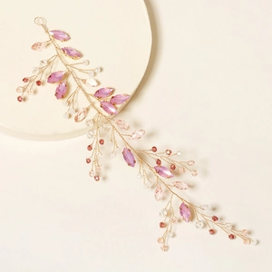 Handgefertigter goldener Haarschmuck mit rosa Kristallen und violetten Perlen