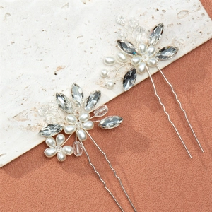 Elegant bridal hair pins set with white pearls and sparkling crystal flowers for updos
