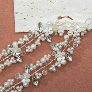 Exquisite bridal hair vine with white pearls and sparkling crystal flowers in silver wire
