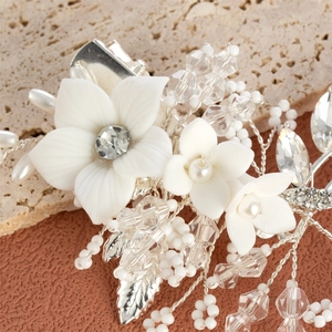 Exquisite bridal hair clip with white ceramic flowers, pearls and crystals on silver wire