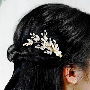 Handmade ceramic leaf and crystal hair clip with white petals on gold wire weave