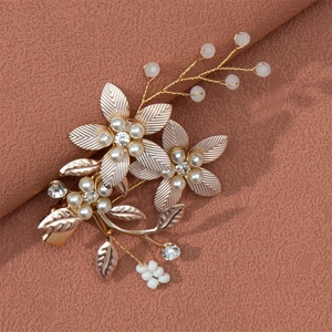 Elegant gold flower hair clip with white pearls and sparkling rhinestones for bridal hair