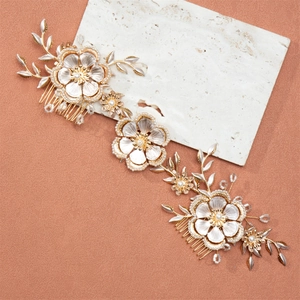 Vintage bridal hair comb with gold metal flowers, pearls, and crystals for weddings