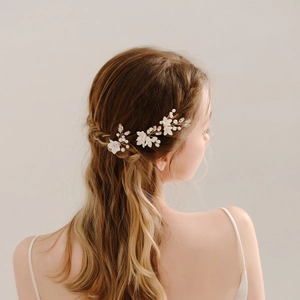 Handmade bridal hair pin with ceramic flowers and pearls for wedding hairstyles