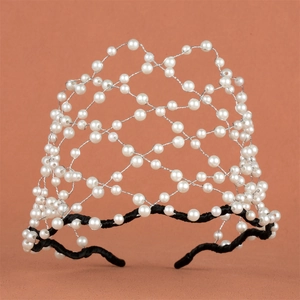 Detailed view of hand-woven bridal headband with white pearls and silver wire mesh
