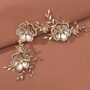 Vintage gold bridal hair comb set with metallic flowers and pearls for wedding hairstyles