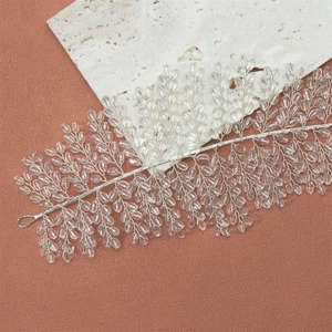 Close-up of handmade bridal headband with crystal leaf beads on silver flexible wire