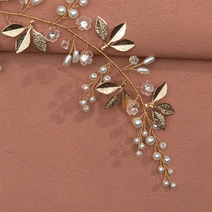 Handmade gold bridal headband with pearls, rhinestones and floral leaves for hair styling