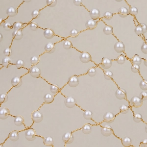 Elegant bridal headband featuring handmade pearls and gold wire mesh details