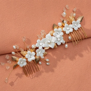 Elegant Chinese bridal hair comb with white ceramic flowers and pearls on golden base