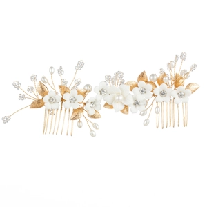 Bridal hair comb with white ceramic flowers, gold leaves, and handcrafted pearls decoration