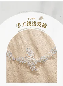 Detail of handmade bridal hair comb with silver alloy leaves, pearls, and rhinestones