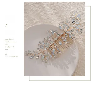 Macro detail of handmade bridal hair comb with blue crystals and golden branches