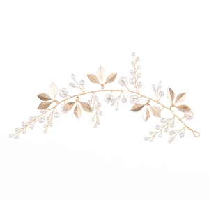 Handmade golden pearl bridal headband with crystals and leaf accents for wedding hairstyles