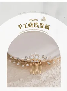 Macro shot of handmade gold wire bridal hair comb with elegant white pearls and crystals