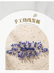 Detail of handmade silver bridal hair comb with blue crystal grapevine leaves and pearls